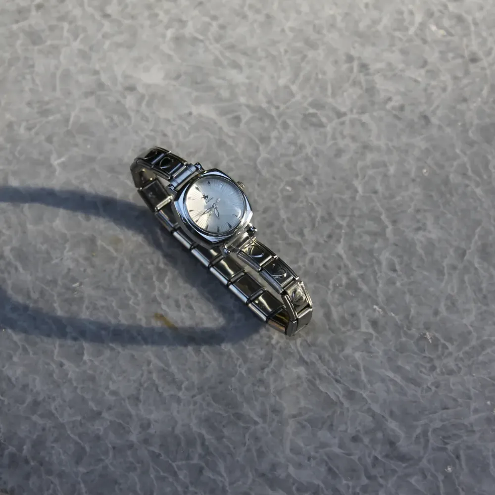 Çelik Silver Kalpli Nomi Charm Beyaz Kadın Saat