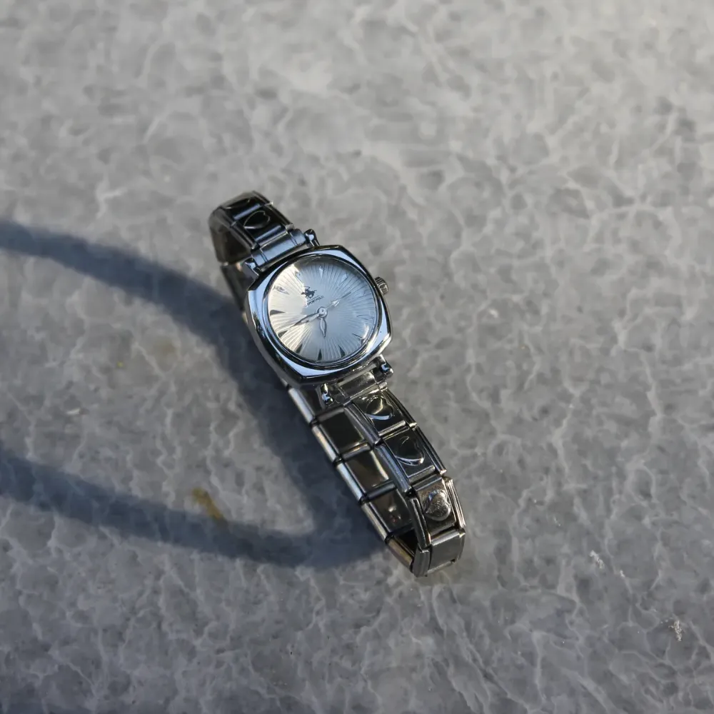 Çelik Silver Kalpli Nomi Charm Beyaz Kadın Saat