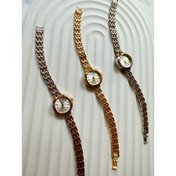 Metal Rosegold,Gümüşgold,Gümüş,Gold renklerde yuvarlar çerçeveli beyaz kadranlı kadın kol saati