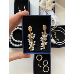 A Bunch Of Pearl Earrings