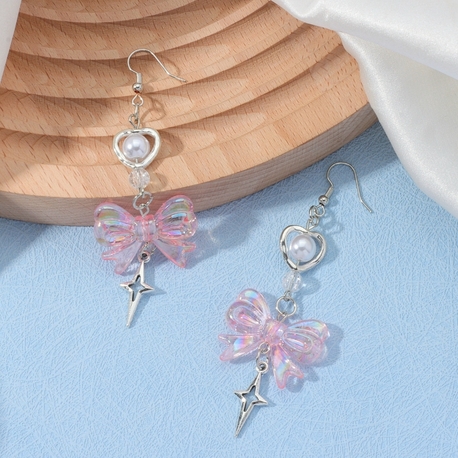Coquette pembe fiyonk detaylı küpe