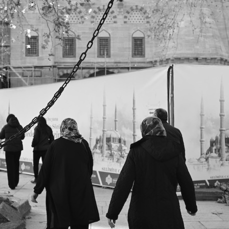 Chain, Minaret and People Clad in Black