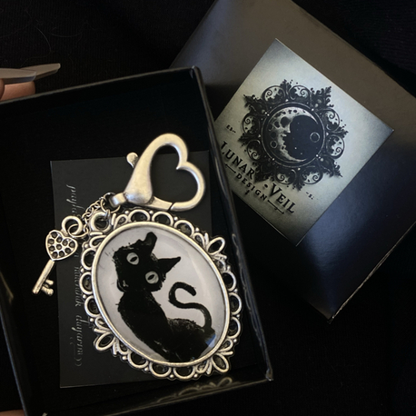 coraline the cat charm‍⬛