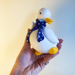 Bisque Porcelain Duck Sculpture with Ribbon