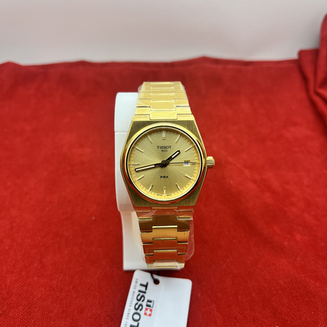 Tissot prx gold