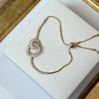İçiçe geçmiş baget taşlı gold suyolu bileklik