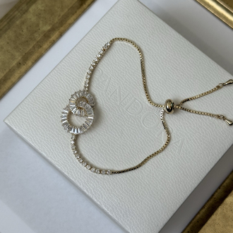İçiçe geçmiş baget taşlı gold suyolu bileklik
