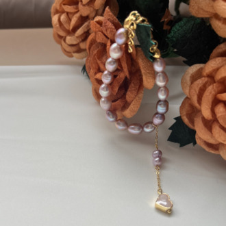 The Enamelled Shine Of Lavender Pearl Love Bracelet