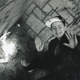 A Young Boy Around Fire