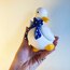 Bisque Porcelain Duck Sculpture with Ribbon