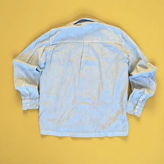 Mavi Marka Hafif dokulu açık mavi chambray gömlek. Rahat oversize kesim, zamansız parça.