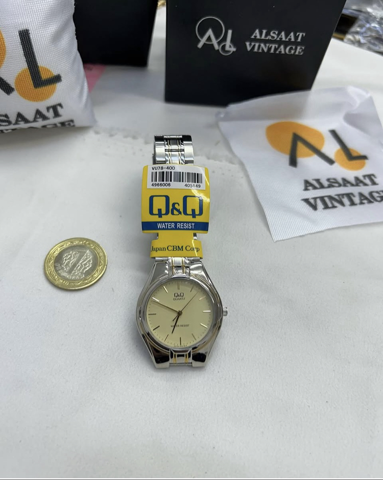 Q&Q Gold Gümüş renk kol saati 
