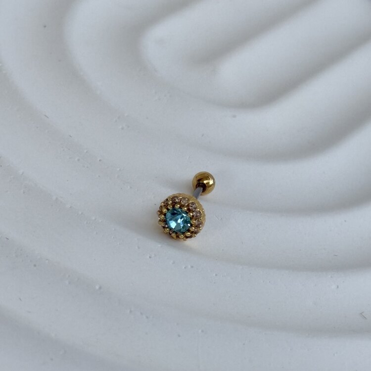 Tragus mavi zirkon taşlı cerrahi çeliktir.