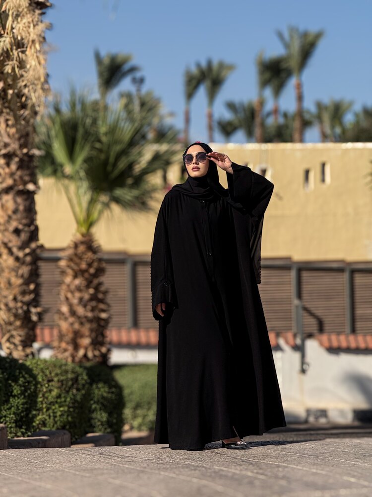 Trenç abaya