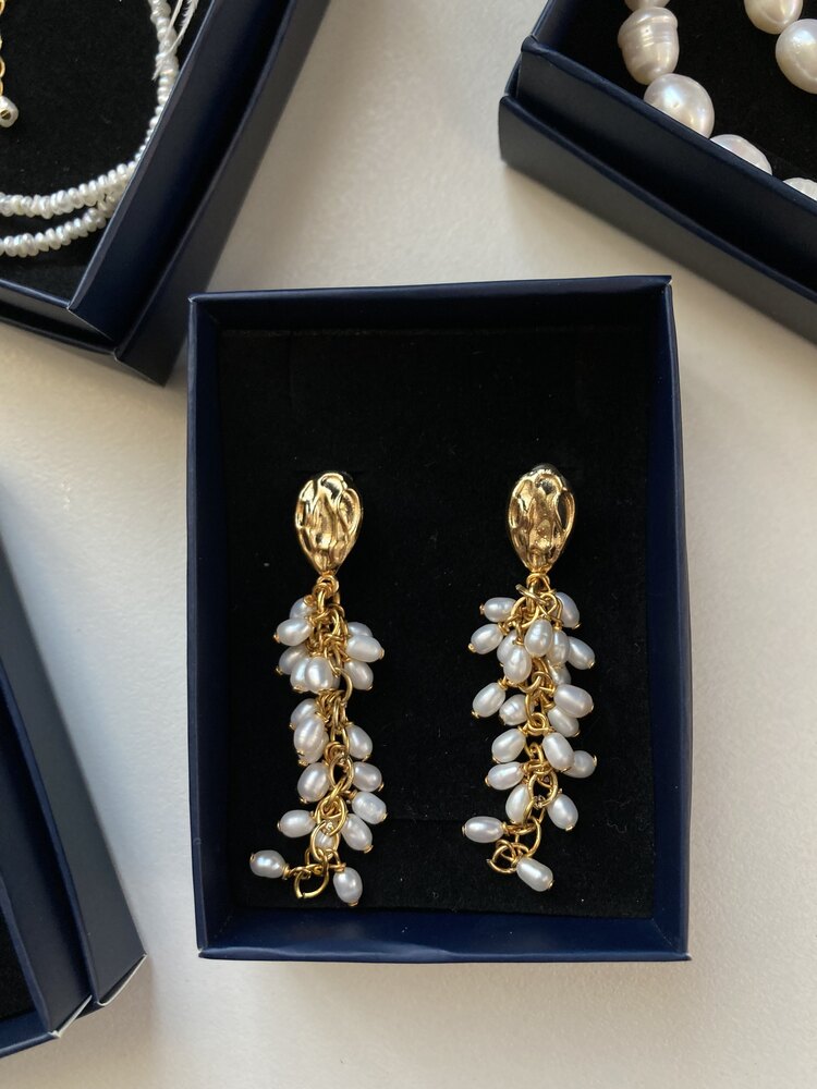 A Bunch Of Pearl Earrings