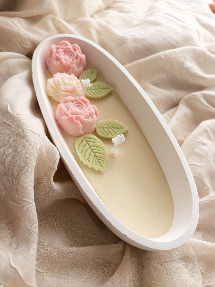 pembe çiçek yapraklı soya mum