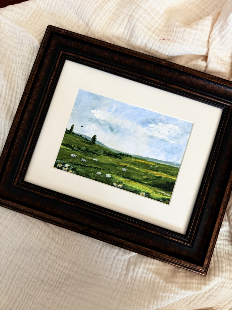 The tones of the green meets with some sheep in the meadow
