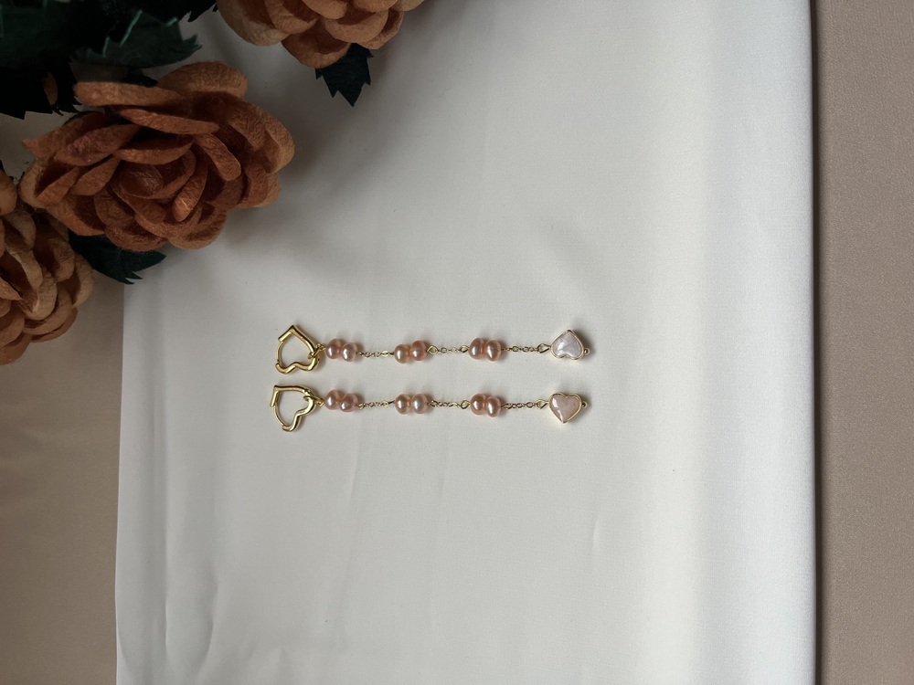 The Enamelled Shine Of Peach Pearl Love Earrings