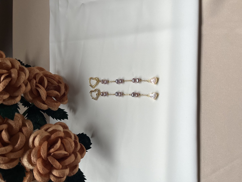 The Enamelled Shine Of Lavender Pearl Love Earrings