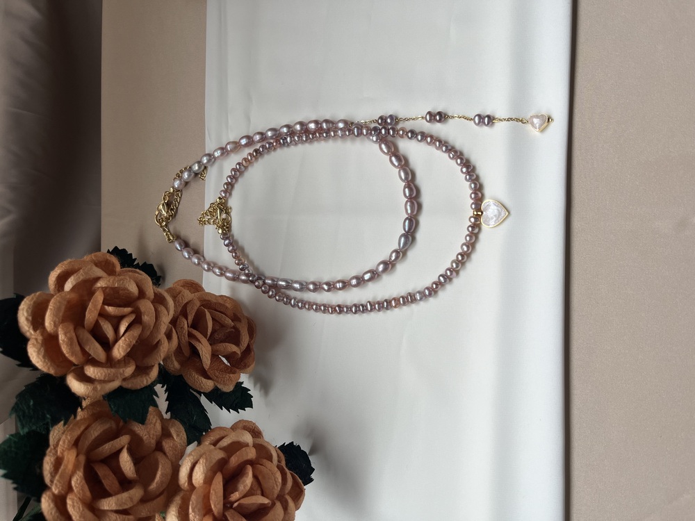 The Enamelled Shine Of Lavender Pearl Love Necklace