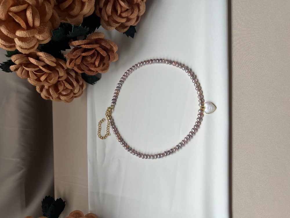 The Enamelled Shine Of Lavender Pearl Love Necklace