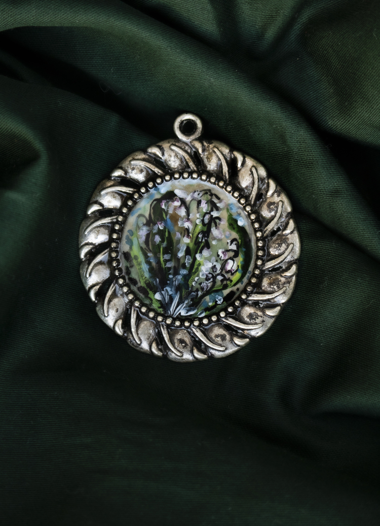 Hand-painted miniature lily of the valleys circular resin amulet