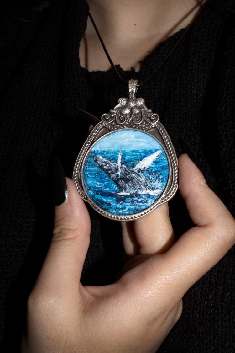 Hand-painted miniature whale amulet