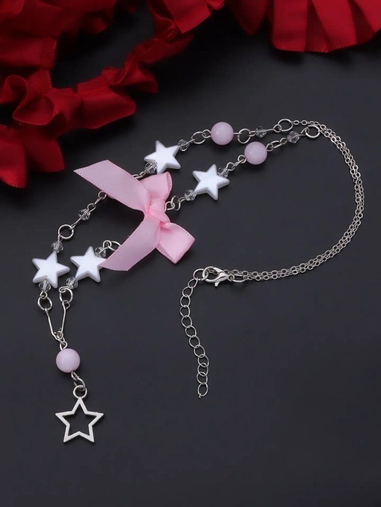 Coquette pembe saten fiyonklu ve yıldız detaylı kolye