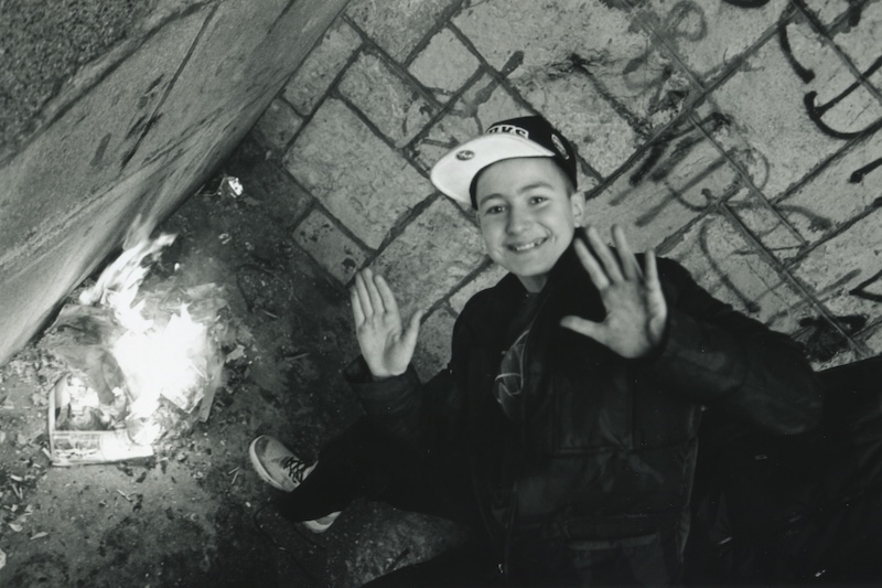 A Young Boy Around Fire