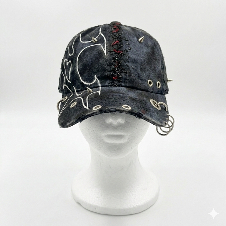 Tribal pattern cap with chain detail.
