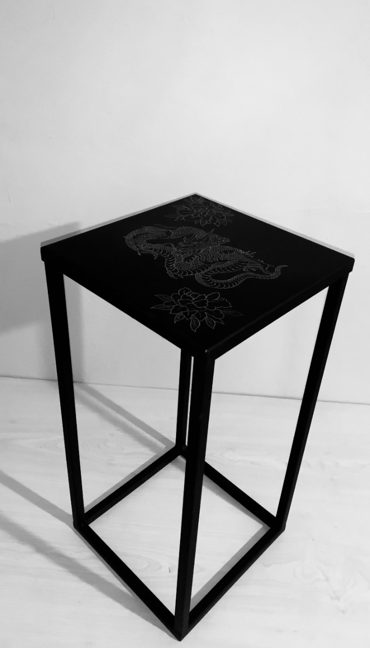 Custom engraved metal unique table.