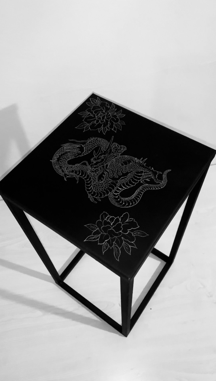 Custom engraved metal unique table.