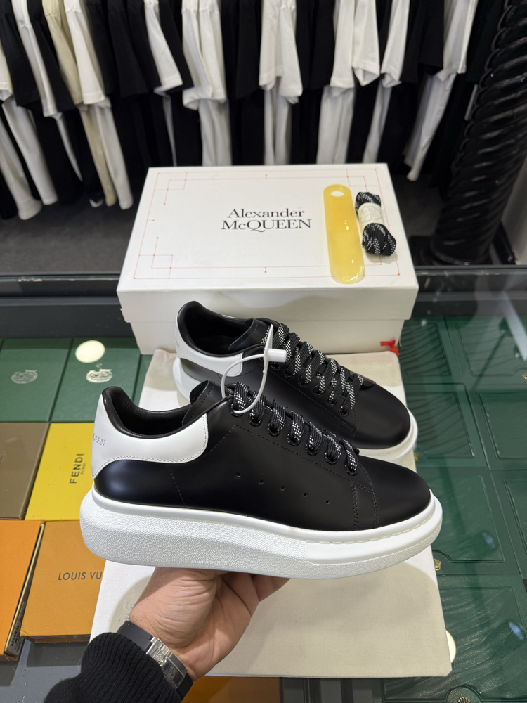 Alexander McQueen Sneaker in Black Leather with White Heel Tab