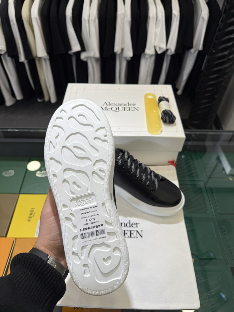 Alexander McQueen Sneaker in Black Leather with White Heel Tab